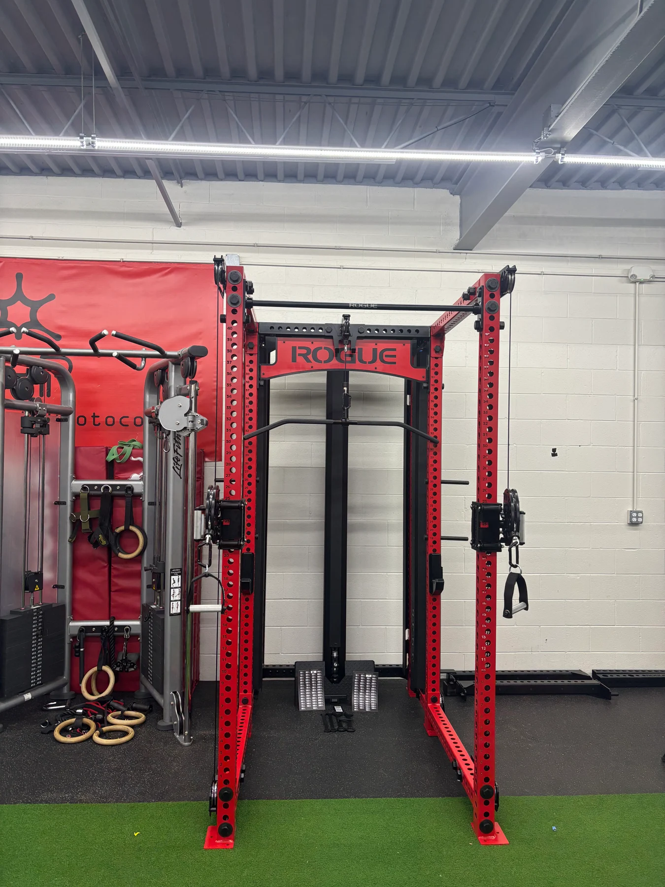 After assembly: a front view of the rack with the cable system, weight stacks, and upper crossmembers in place.