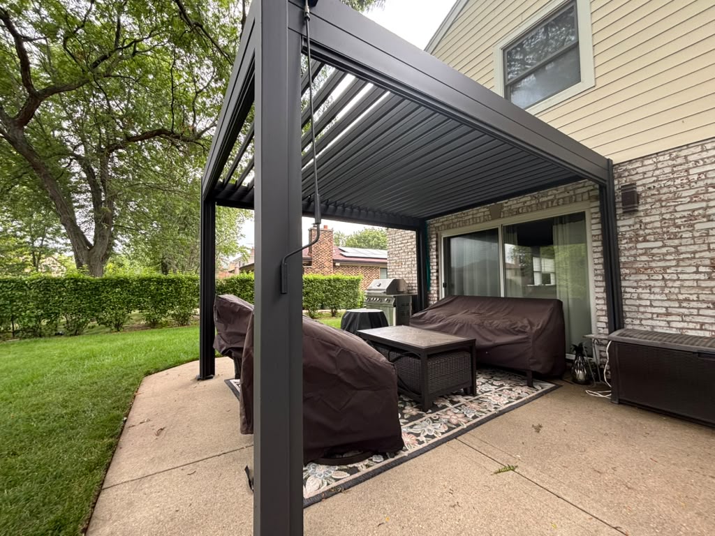Completed aluminum pergola over a patio seating area